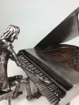 metal piano player